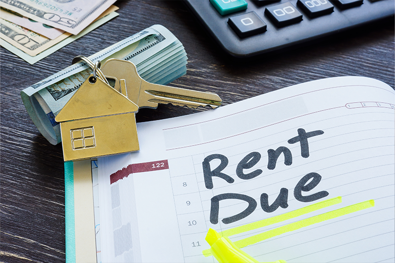 Rent due sign in the planner and key