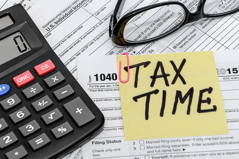 tax form with callculator and glasses
